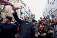 • Supporters of Tunisia's Salvation Front opposition coalition react during a protest over the arrest of some of its leaders and other prominent critics of the president