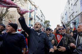 • Supporters of Tunisia's Salvation Front opposition coalition react during a protest over the arrest of some of its leaders and other prominent critics of the president