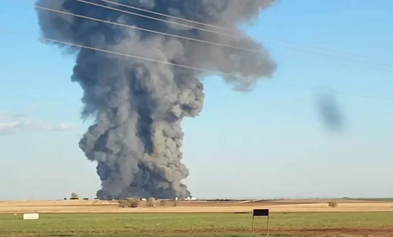 Smoke rises from the scene of South Fork Dairy near Dimmit, Texas