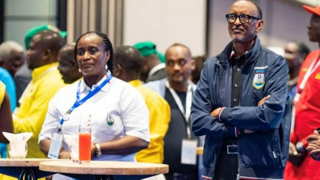 • Ms Uwimana (left) with President Kagame (right) at the party's national congress