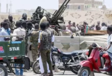 Port Sudan residents and Sudanese army troops mingled on the street on Sunday