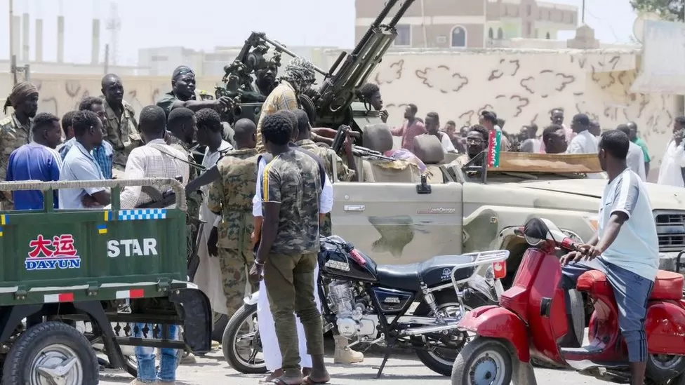 Port Sudan residents and Sudanese army troops mingled on the street on Sunday