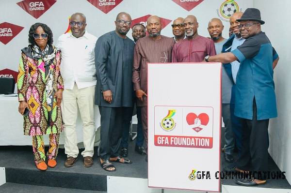 • Mr Okraku (third left) together with some Executive Council members after unveiling the Foundation logo