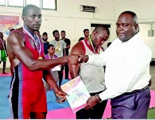 • Mr Amefu (right) presenting a certificate to one of the winners