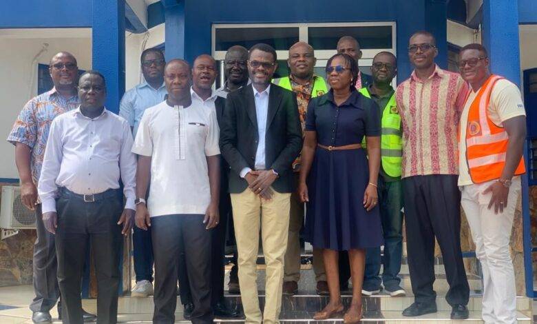 Mr Michael Buabin with Ghana Water Company Limited officials after the meeting