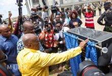 President Akufo-Addo unveiling a plaque to start the housing project