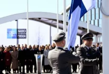 • Finnish military personnel raised their country's flag at NATO headquarters for the first time