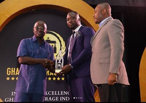 • Mr Ofei (second from right) receiving the award from Mr Boateng