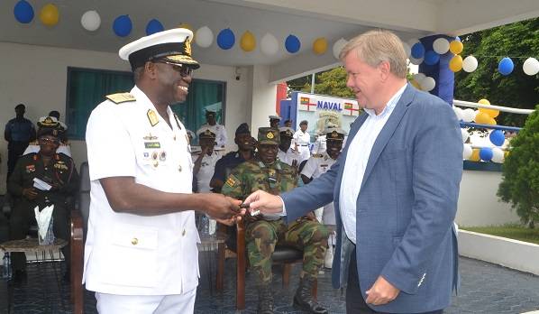 • Rear Admiral Issah Yakubu (left) receiving the keys to the vehicles from Mr Tom Nørring Photo: Victor A. Buxton