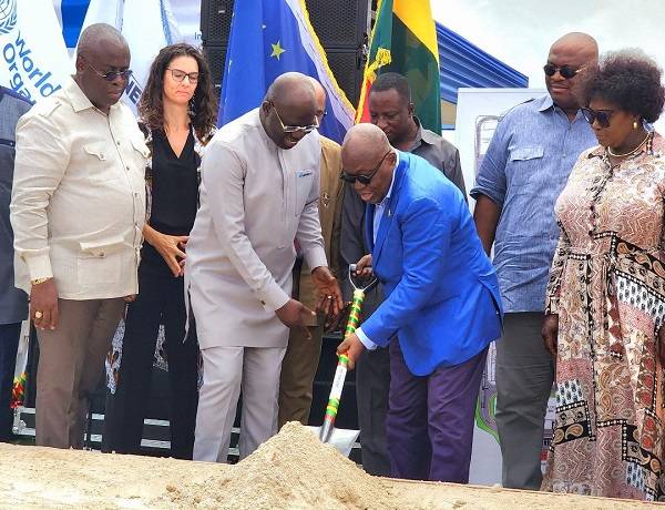President Akufo-Addo (middle) cutting sod for the start of the project