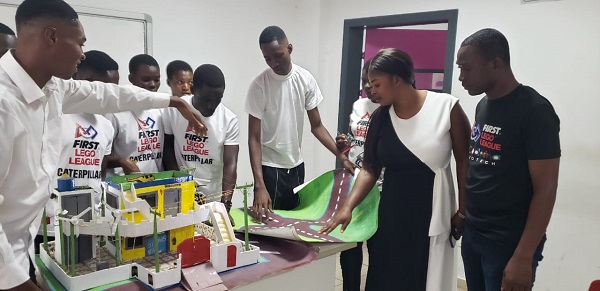 • Ms Sika Afra Mensah (second from right) watching robotics demonstration by the students