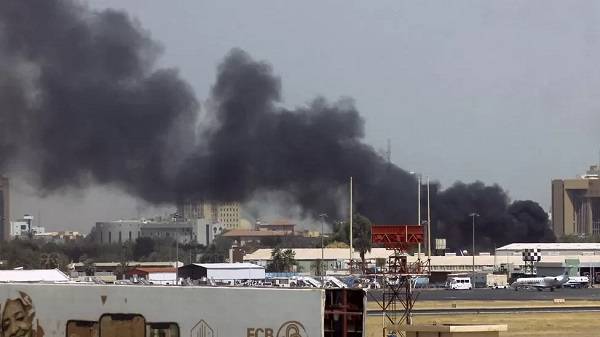 • Smoke rises above buildings at Khartoum's airport