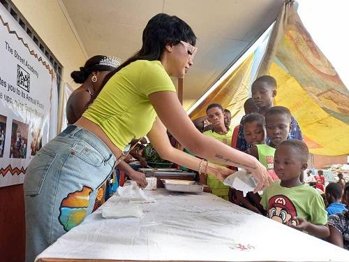• Ms Owusu-Bonsu serving the children