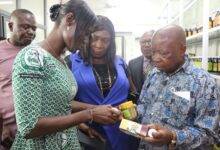 Staff of CPMR explaining some preparations produced by the centre to Mr Kwaku Agyeman-Manujpg
