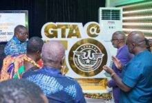 Dr Awal (third from left) assisted by some GTA officials to unveil the 50th anniversary logo.