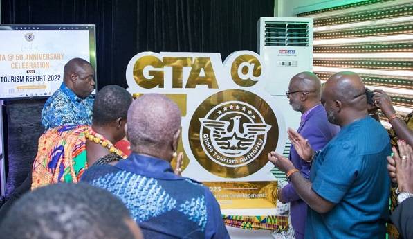Dr Awal (third from left) assisted by some GTA officials to unveil the 50th anniversary logo.