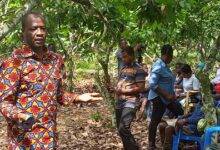 Mr Fiifi Boafo addressing cocoa farmers at Anomawobidi