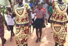 Church members from the Presbyterian church of Ghana on the street singing