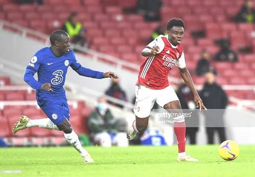 Arsenal’s BukayoSaka (right) being given a chase by N’GoloKante of Chelsea in their previous clash