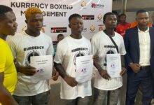 Coach Carl Lokko (left) and Mr Aboagye (right) with the three new signees in the middle