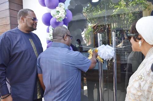 Rev Solomon Kotey Nikoi(back to camera) cutting the tape to inaugurate the office. Photo. Vincent Dzatse