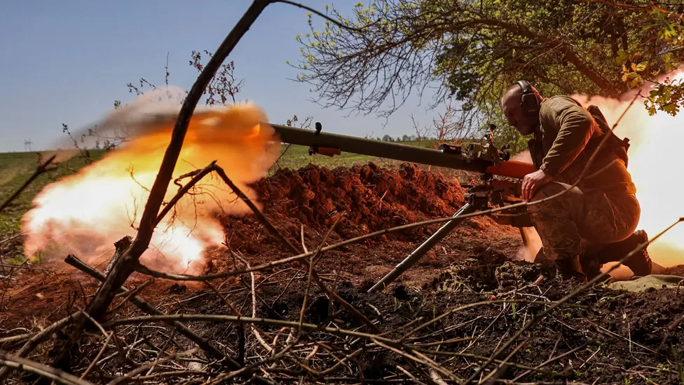 A Ukrainian soldier firing an anti-tank grenade launcher