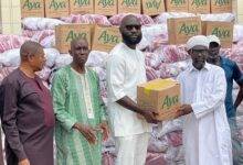 Mr Agyapong presenting the items to Sheikh Musa while other officials look on