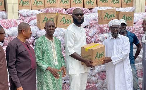 Mr Agyapong presenting the items to Sheikh Musa while other officials look on