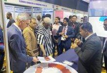 Mr Seini (hand stretched) inspecting the exhibition together with other dignitaries