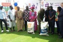 • Mr Acheampong (fifth from right) with Mr Valk (extreme right) inspecting some of the fertilisers