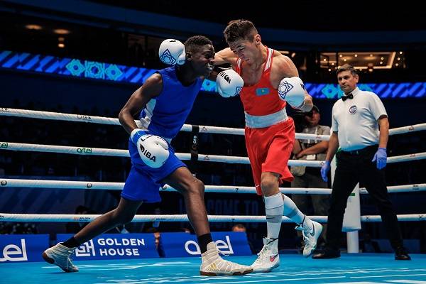 Ghana's Amadu Mohammed (left) is set to benefit from the IBA rewards despite losing his quarter final fight