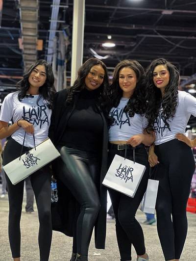 Staff of Hair Senta showing the company’s brand.