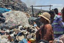 Ms Cecilia Abena Dapaah(in hat) with the team inspecting some gathered plastics for recycling at a dumping site at Agbobloshie. Photo Godwin Ofosu-Acheampong