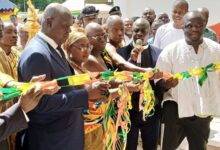 Inset, Justice Anin Yeboah (left)being assisted by other dignitaries to inaugurate the building