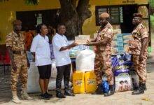 DSP Dartey (right) receiving the items from Rev. Badu