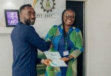 Mr Ankamah exchanging a document with Vice Chancellor of KNUST, Prof Rita Akosua Dickson