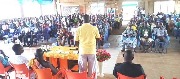 Mr Boaz Ofosu Asiedu addressing the cocoa farmers