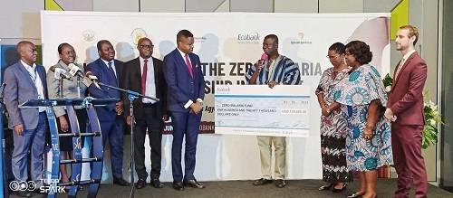 • Dr Awuah (fourth from right) thanking Ecobank Ghana after taking the cheque from Dr Botchway (fifth from left