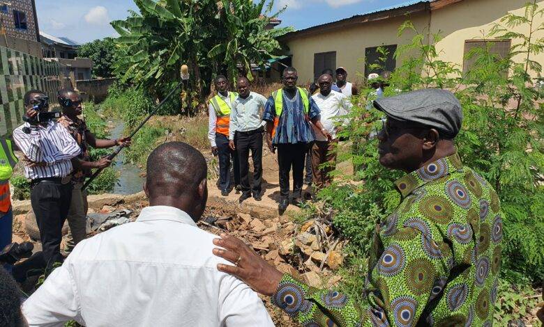 Mr Dan Botwe (right) with the team inspecting a drinage at Kwashibu in Accra. Photo Godwin Ofosu-Acheampong