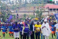 Medeama owner Moses Parker (yellow) joined by management members and technical staff to acknowledge cheers from the fans