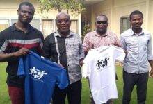 Mr Fianoo (Second left) presents branded T-shirts of the NGO to the Times Sports Reporters, John Vigah (seond right) and Andrew Nortey (left) while Mr Siaw looks on
