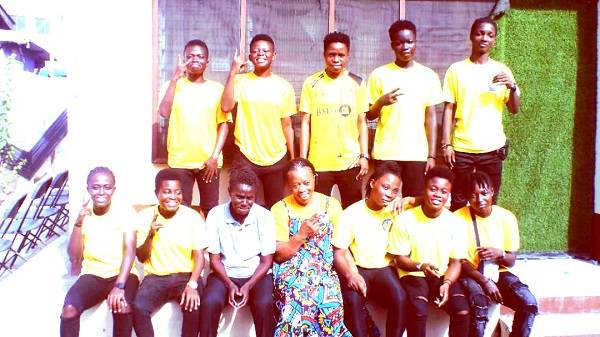 • Ms Abaidoo (middle) with Mad Adzerkwei and players of Ideal Ladies FC