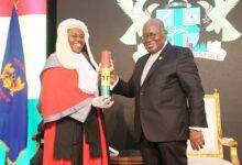• President Akufo-Addo presenting the scroll of office to Justice Gertrude Araba Essaba Sackey Torkornoo