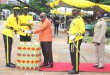President Akufo-Addo(middle) presenting a sword to Akyamfour Baah Kwaku Baffour the overall best Cadet