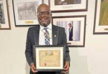 • Bishop Dr Glover displaying his award