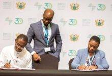 • officials of the two institutions signing the document