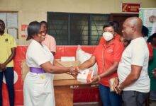 The Vodafone Foundation team presenting the items to the hospital