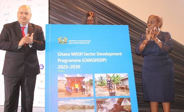 Ms Cecilia Abena Dapaah (right) and Mr Saroj Kumar Jha applauding after launching the Ghana wash sector development programme (GWASHSDP) . Photo. Ebo Gorman
