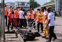 Workers of Zoomlion Ghana Limited in a massive cleanup exercise
