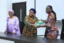 • Ms Cessouma (left) presenting a souvenir to Ms Amma Twum-Amoah